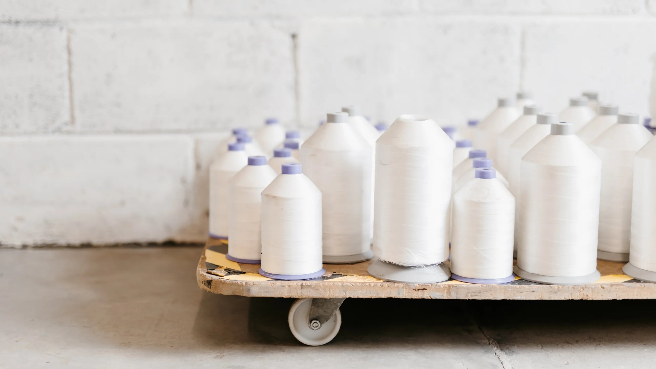 bobbins on a trolley in a quilting factory UK - industrial quilting services in the south of England